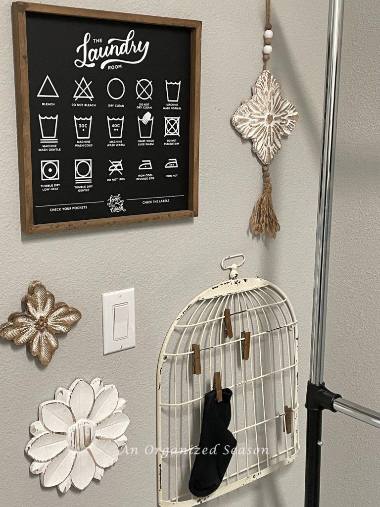 Hang a sign explaining laundry symbols and a rack for lost socks, tip nine to create an organized laundry room.  