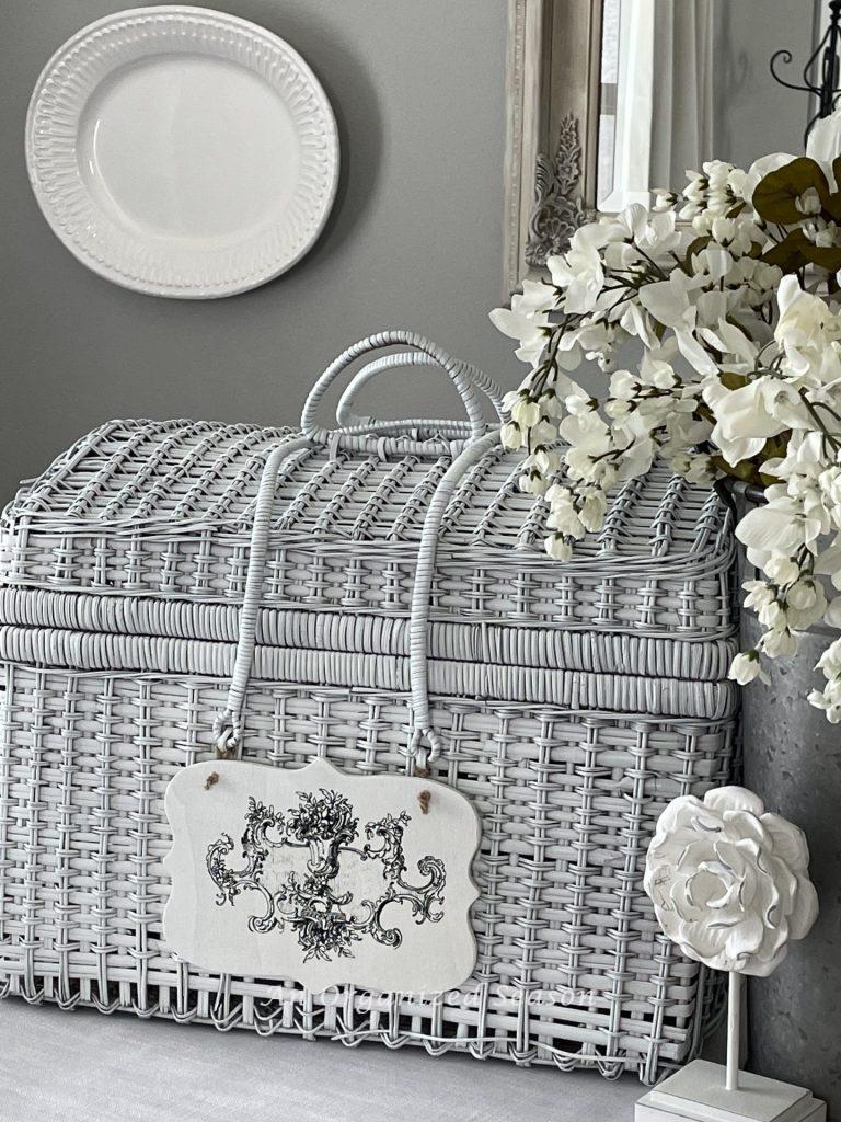An upcycled white picnic basket.