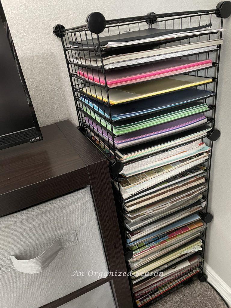 Organize must-have craft supplies by purchasing vertical paper storage shelves.