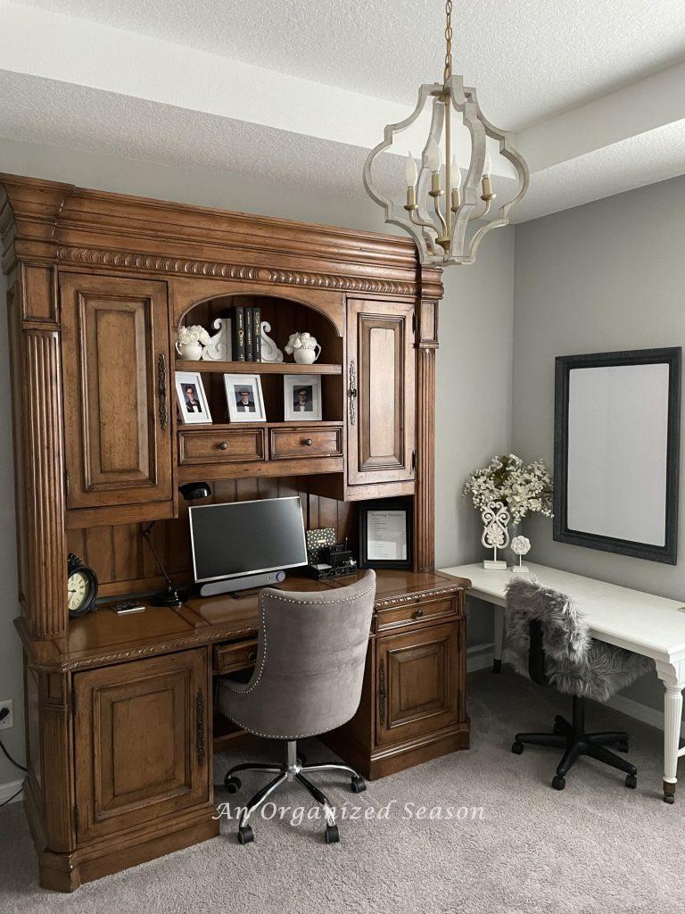 A large wooden desk with storage in an office. 