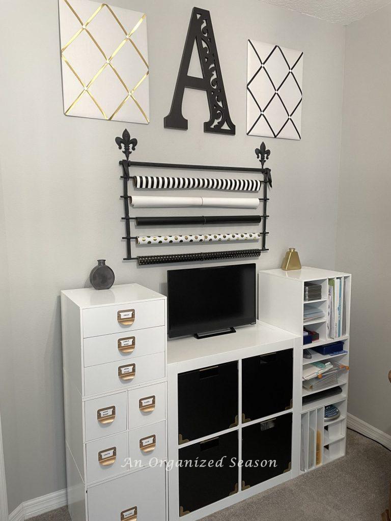 White cubbies storing craft supplies in an office. 