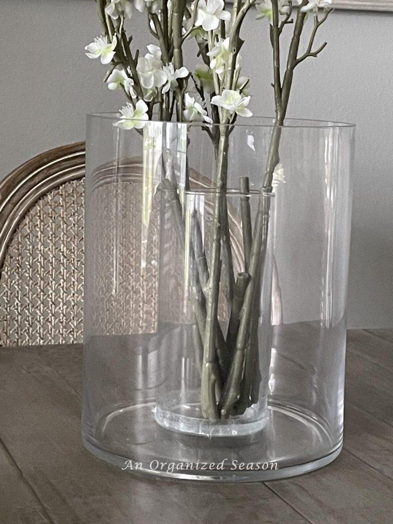 Flowering stems inside a glass vase. 