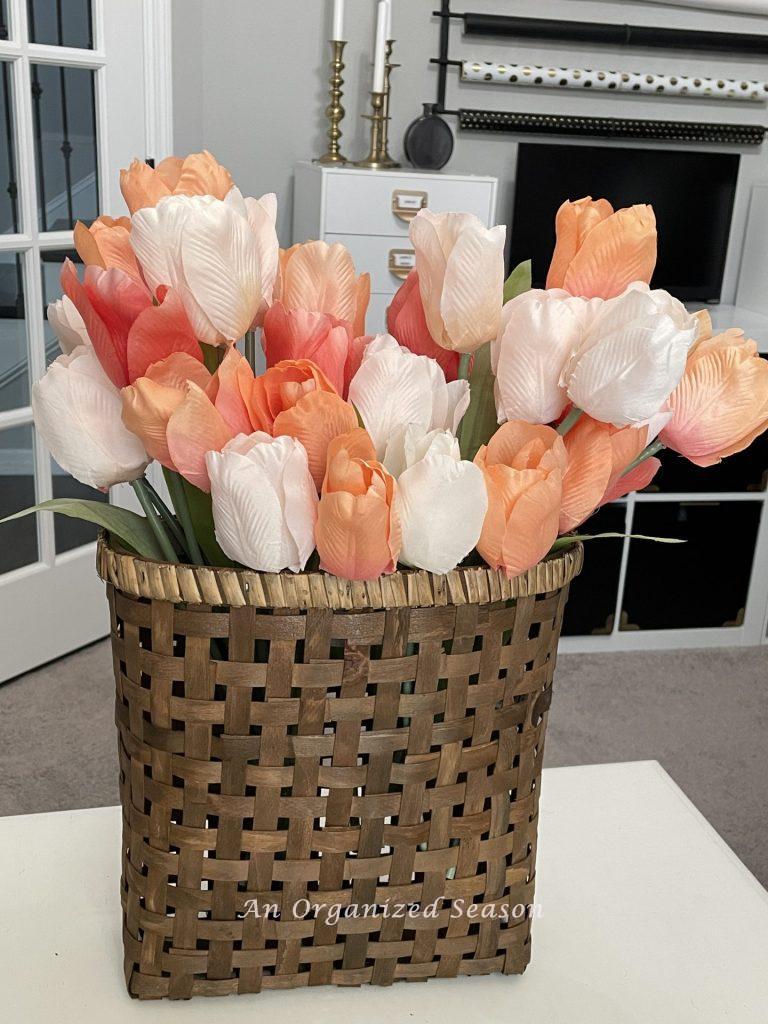 Tri color tulips in a basket.