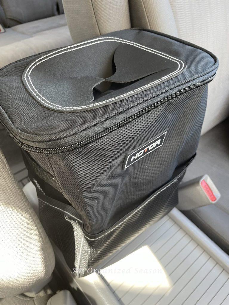 A trashcan made for a car is the perfect road trip essential.