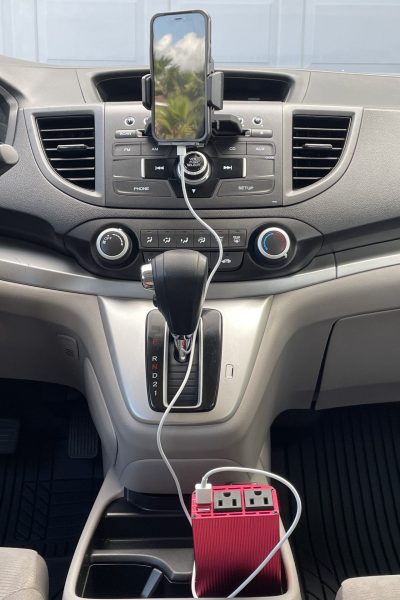 Hands free cell phone, charger, and cord in car.