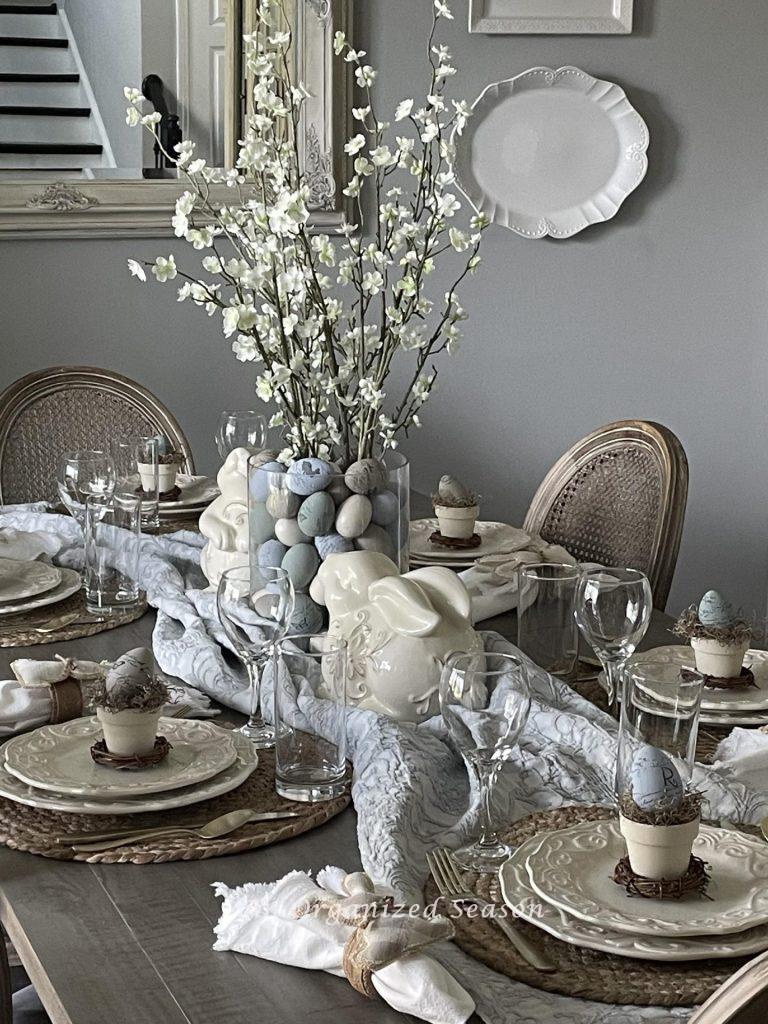 Blue and neutral colored Easter table decor. 