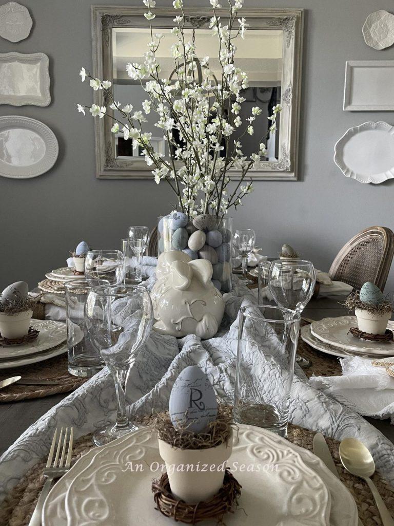 A dining table set and decorated for Easter dinner. 