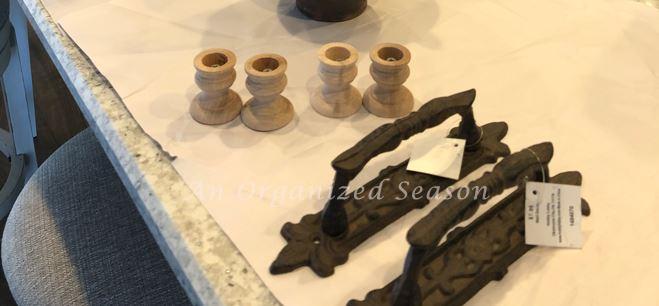 Purchase wood candlestick holders and metal handles to put on the DIY wood board. 
