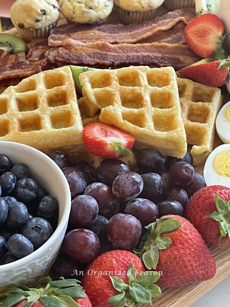 Bacon, grapes, waffles, and blueberries.