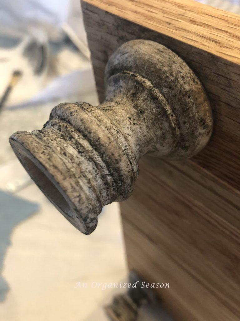 Antique the feet and handles of your DIY wood board with wax.