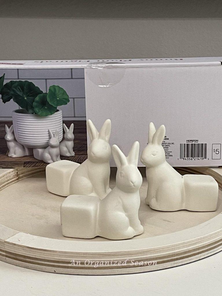 Gather bunny figures and a mandala to make a DIY tray.