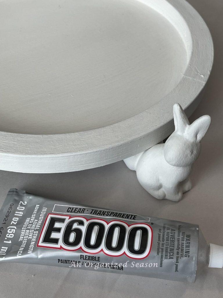 Glue the bunny figures to the DIY wood tray with E6000 glue. 