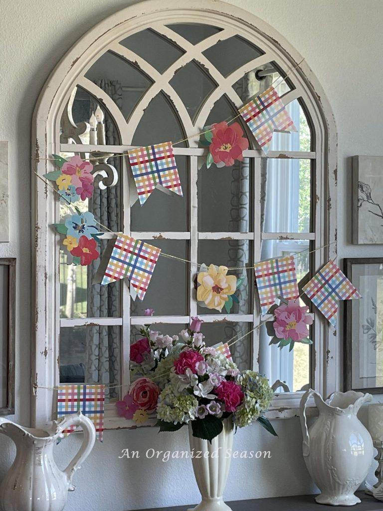 Flower garland hanging on a mirror. 