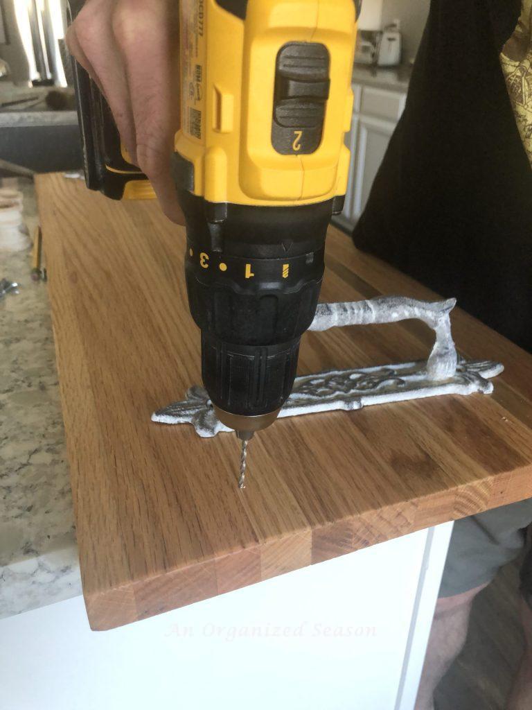 Screw holes in the DIY wood board to attach the handles.