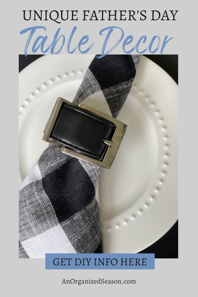 Belt buckle napkin ring holding a buffalo check napkin.