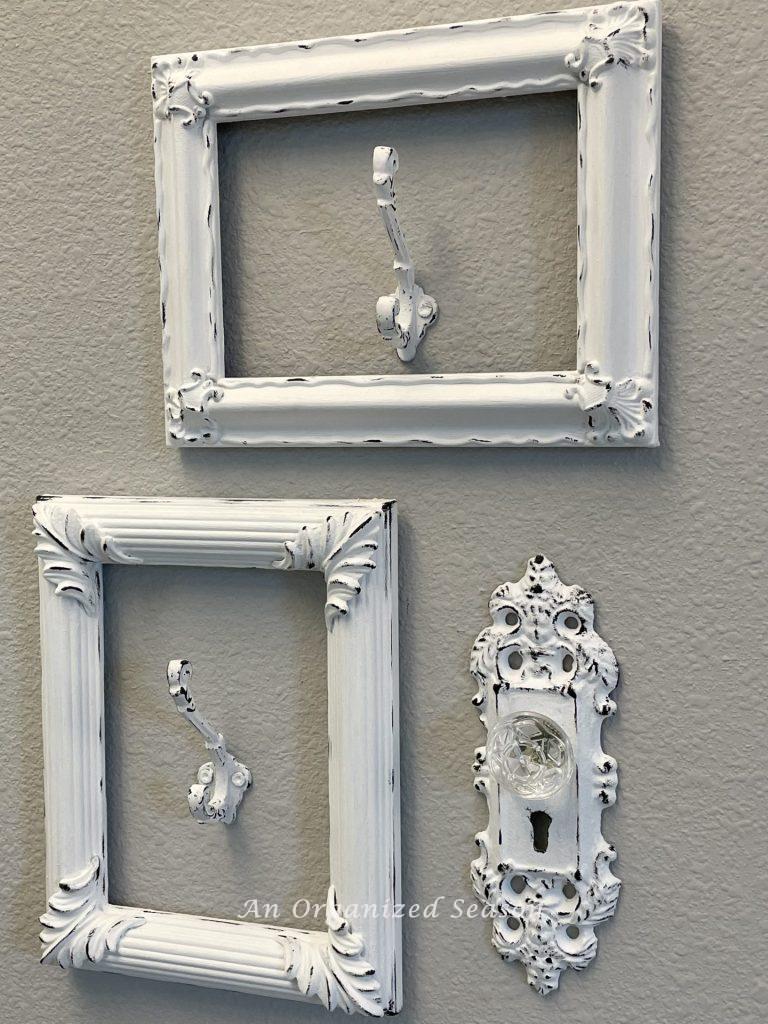 White frames with white hooks inside. 