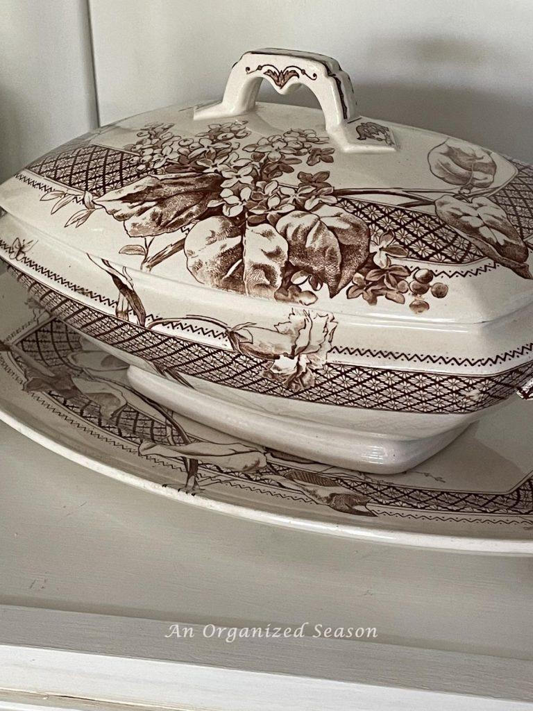 A brown transferware soup tureen with lid and matching platter are a favorite thrifted find. 