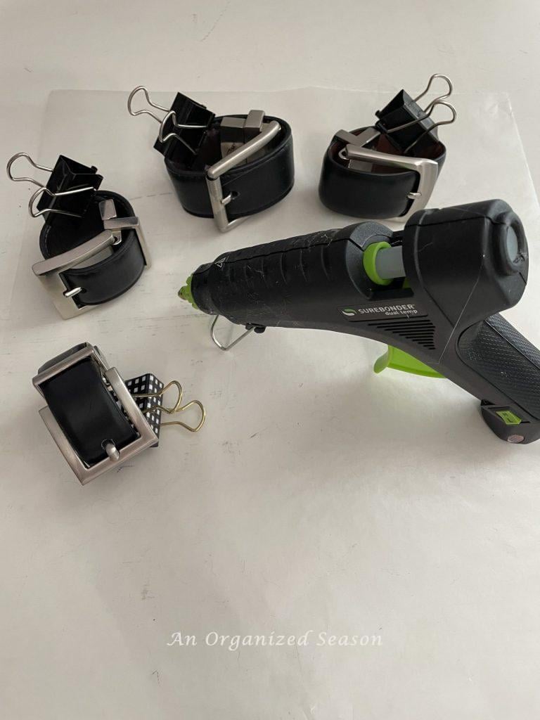 Belts hot glued to make napkin rings.