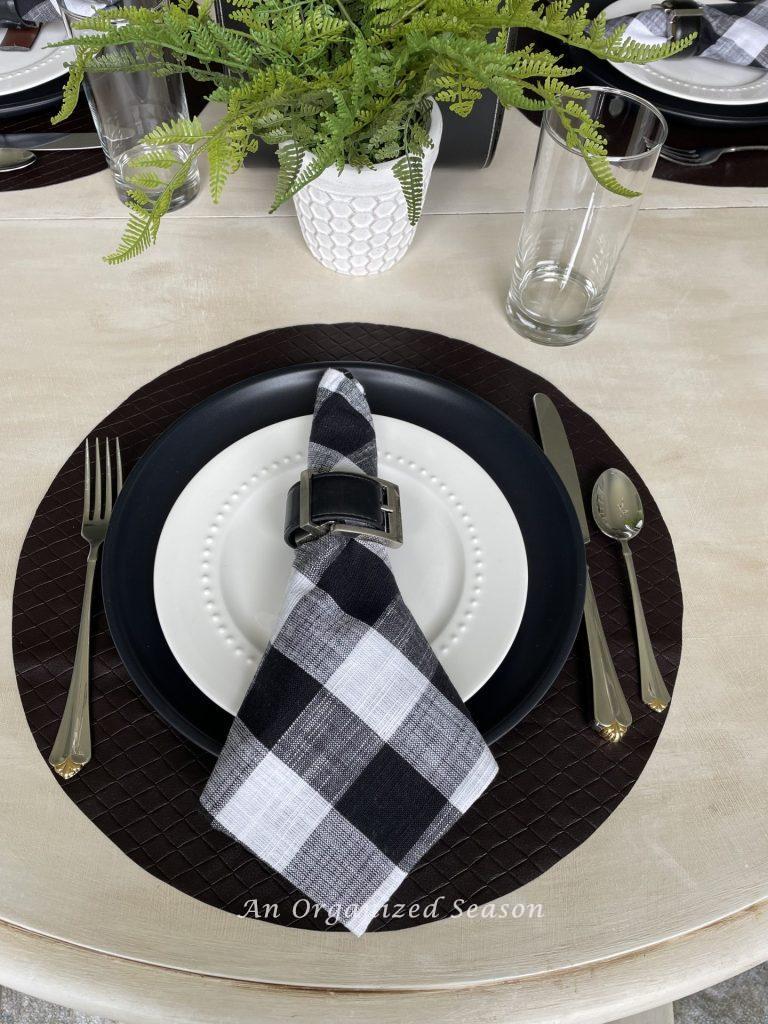 Black, white, and brown place setting makes the perfect table decor for Father's day! 