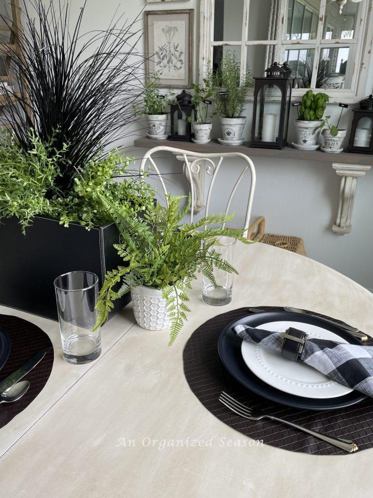 A kitchen table decorated with black, brown, and white.