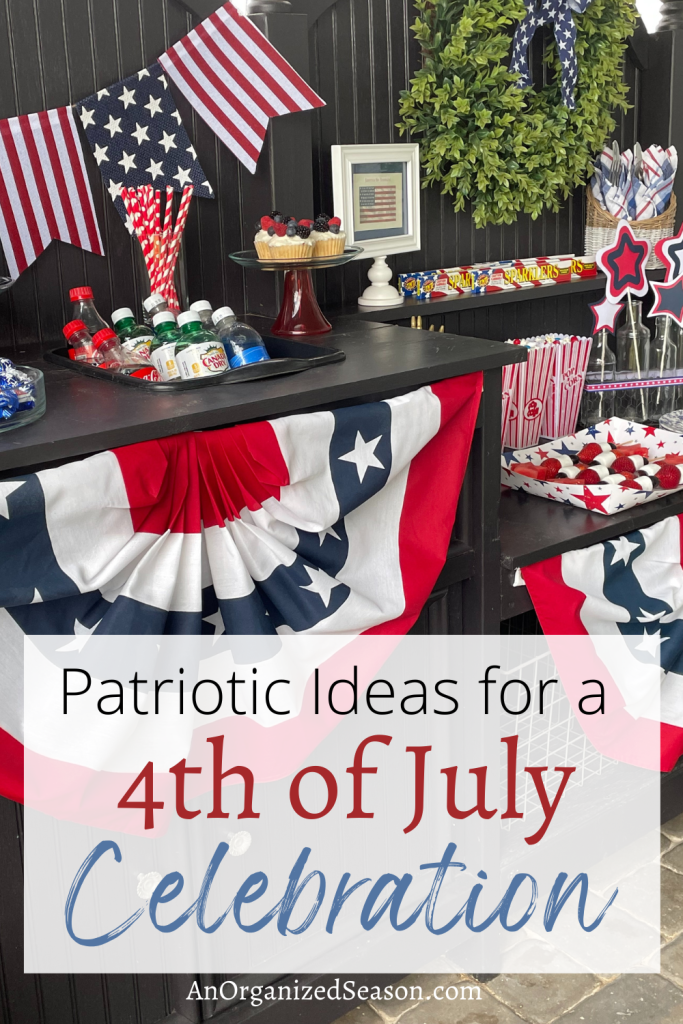 A potting bench decorated and set with food for a 4th of July party.