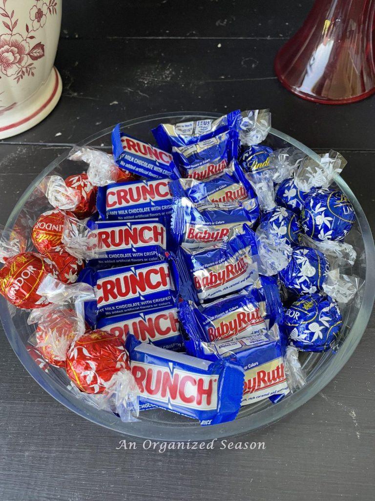 Glass dish filled with red, white, and blue candy.