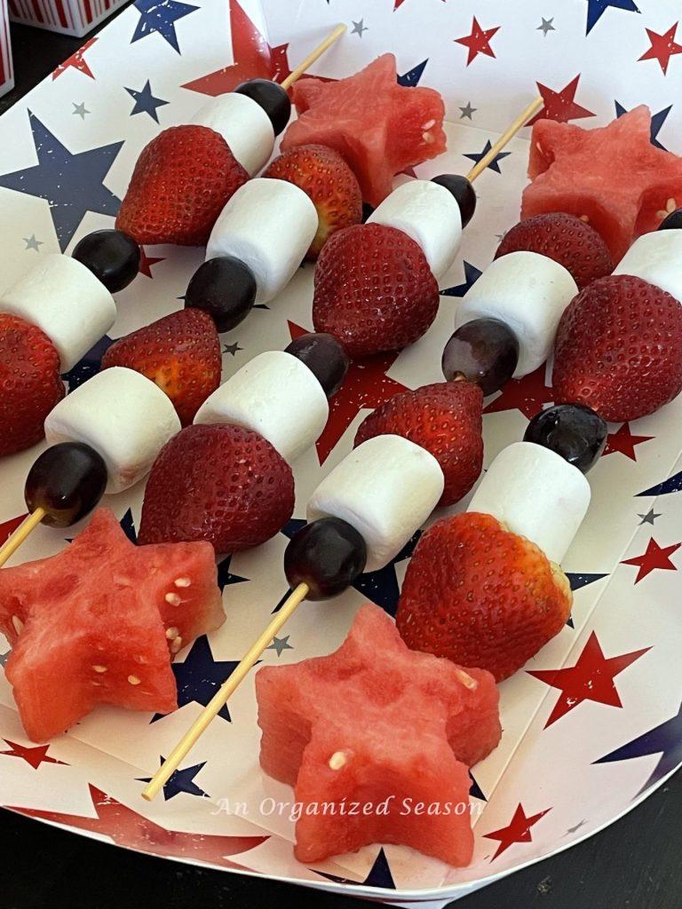 Fruit skewers made with grapes, strawberries, marshmallows, and watermelon cut in the shape of a star! 