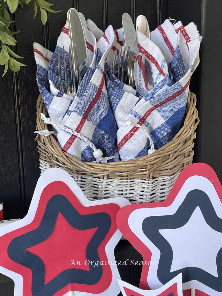 Patriotic idea number six is to wrap eating utensils in red, white, and blue napkins and place them in a basket. 