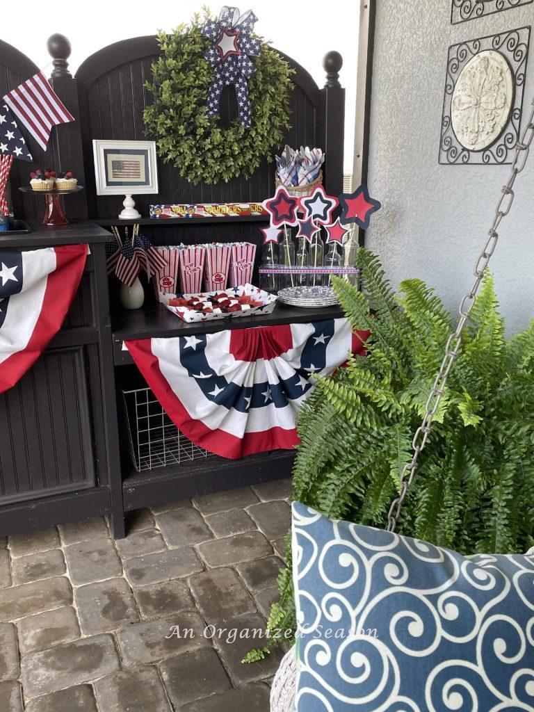 Potting bench set up to serve food for a 4th of July party. 