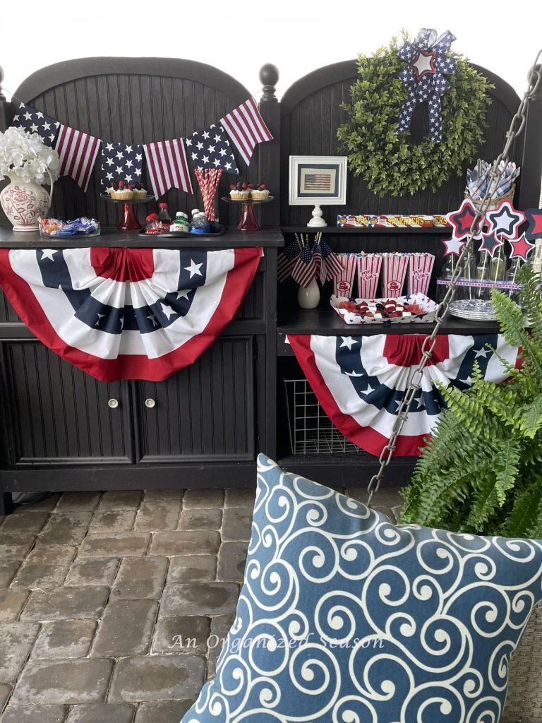 Potting bench decorated and serving food for a 4th of July celebration. 