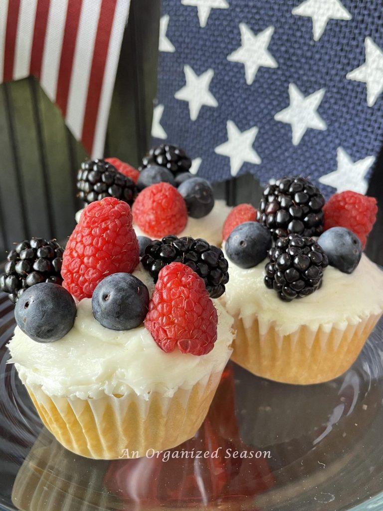 Cupcakes topped with blueberries, blackberries, and raspberries!