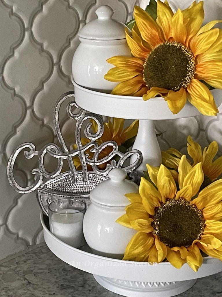 Summer decor tip #5, Add sunflowers to a tired tray in a coffee bar. 