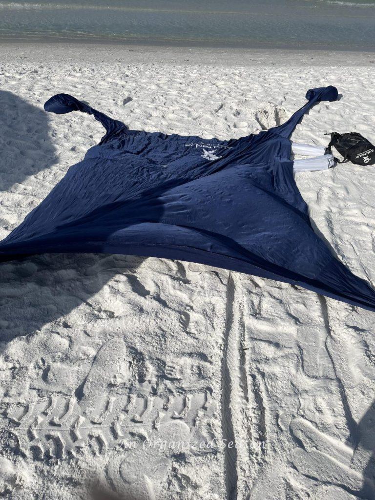 A Ninja tent spread on the sand is a beach essential. 