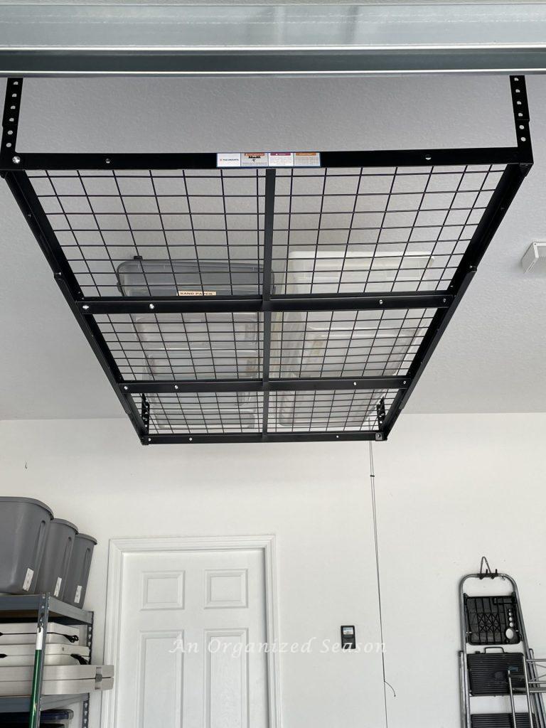 Overhead garage storage unit hanging from the ceiling. 
