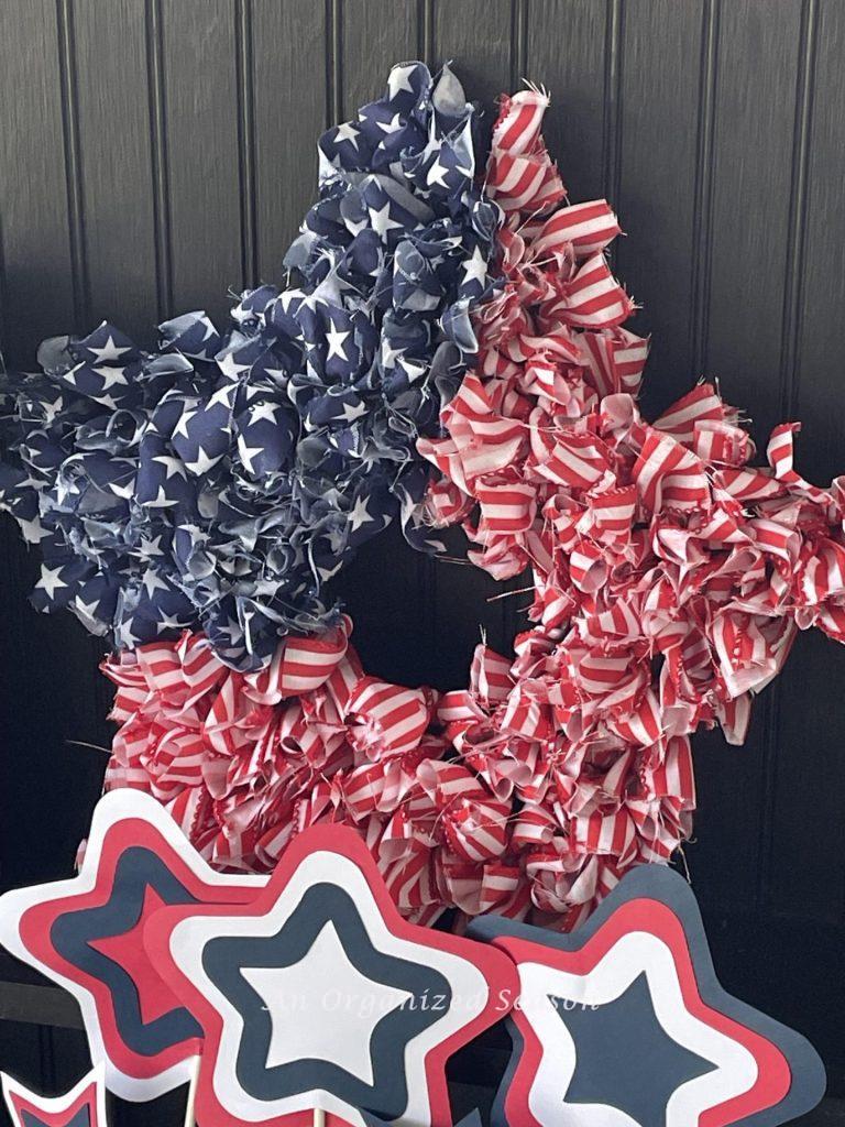 A star-shaped DIY 4th of July wreath that looks like an American flag.