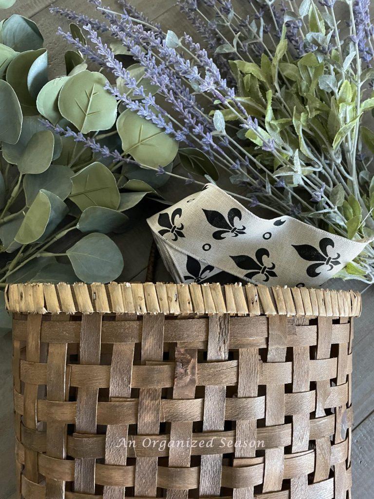 Gather  a basket, lavender stems, eucalyptus, and ribbon to make a lavender wreath.