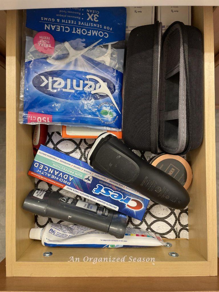 A messy bathroom drawer that needs to be organized. 