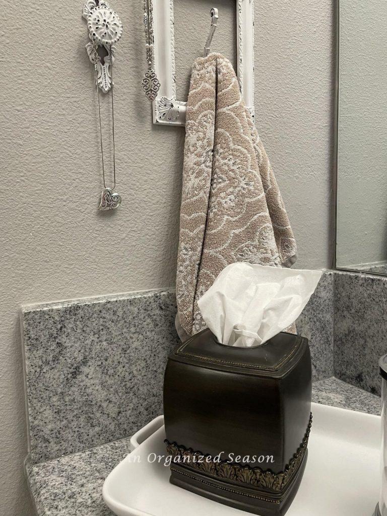 A brown tissue box sitting on a white tray. 