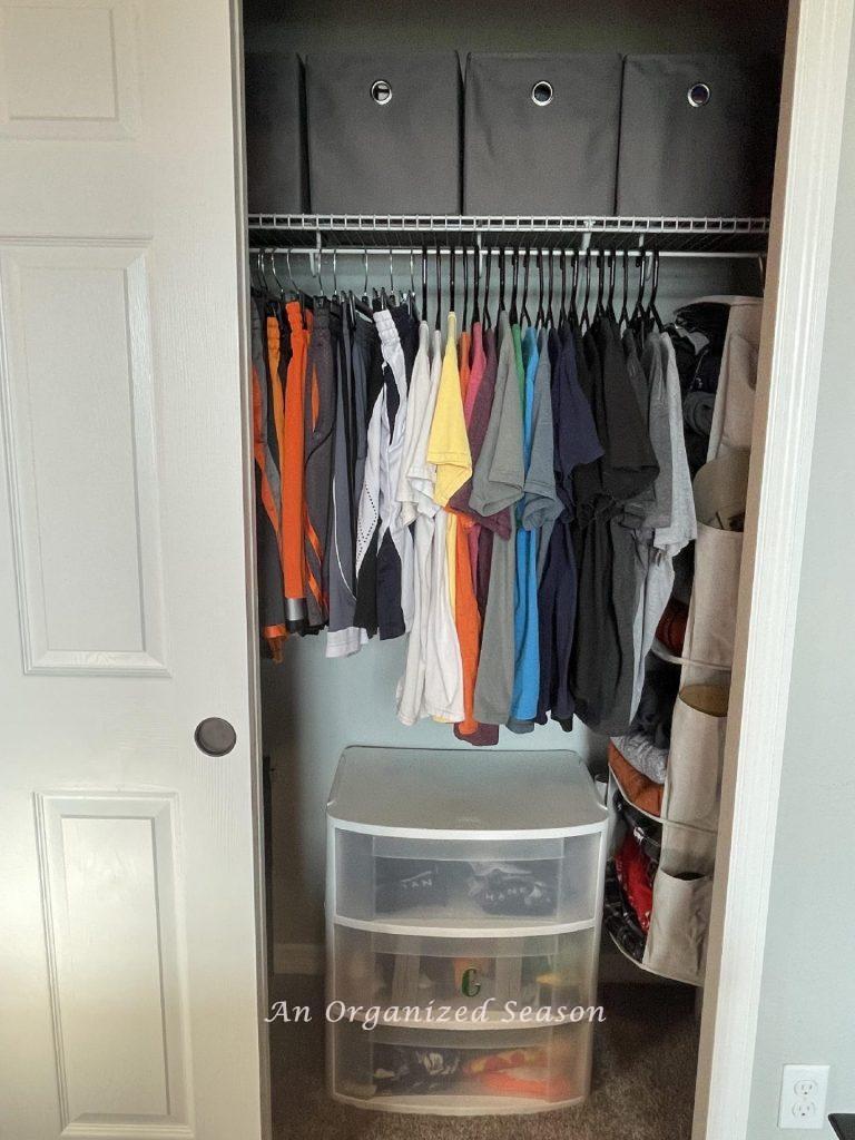 Closet organization idea # seven is to put a set of pull-out drawers under the hanging clothes in a closet. 
