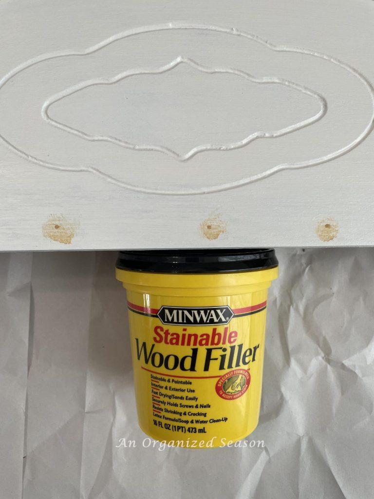 Step three of our scrap wood projects is to repair the nail holes with wood filler. 