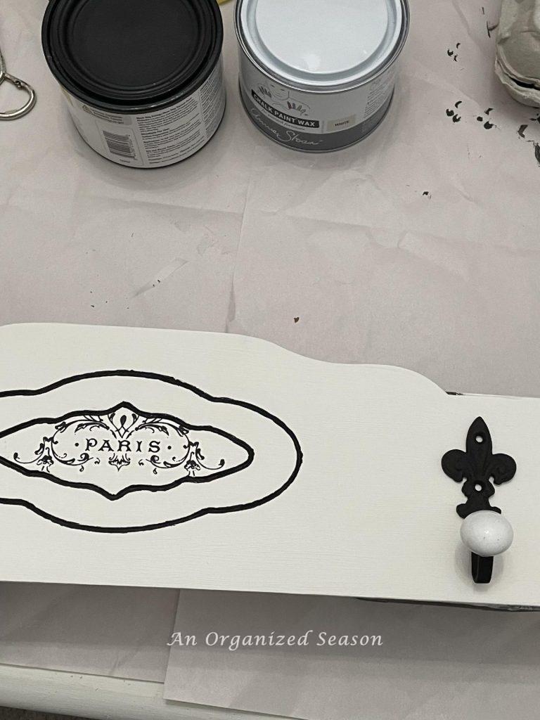 Determining placement of towel hooks on board.