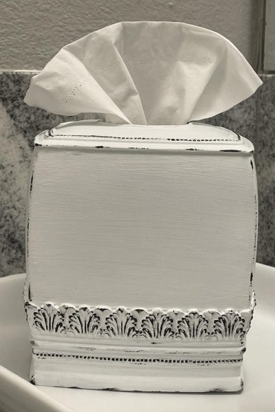 A distressed black and white tissue box.