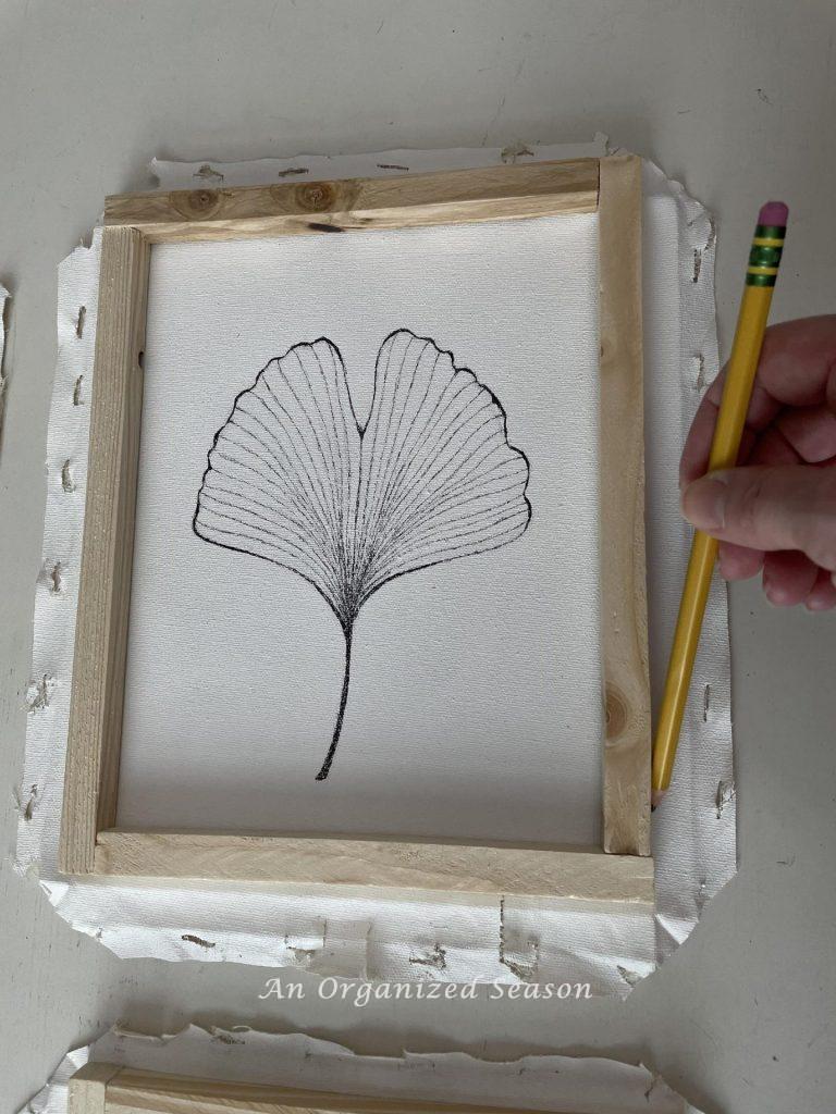 Step to five make framed canvas wall art is to draw a line on the canvas around the outside of the frame.