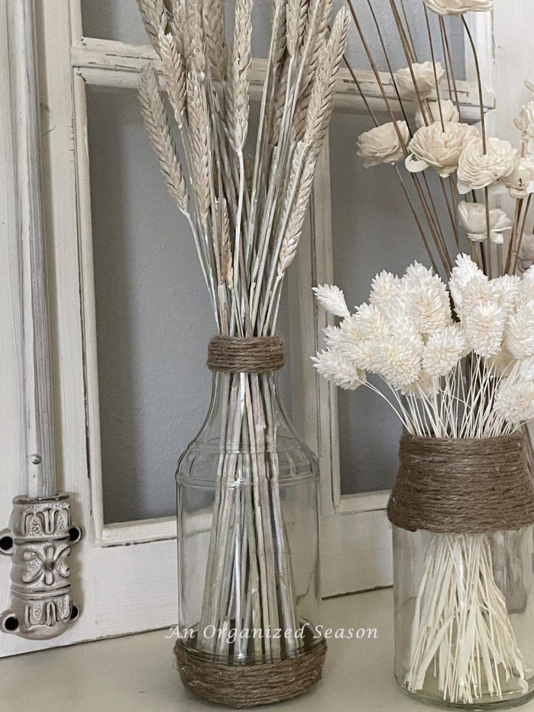 Glass vases decorated with twine. 