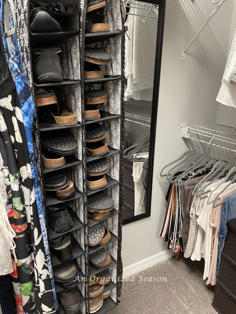 Hanging shoe organizer inside a closet. 