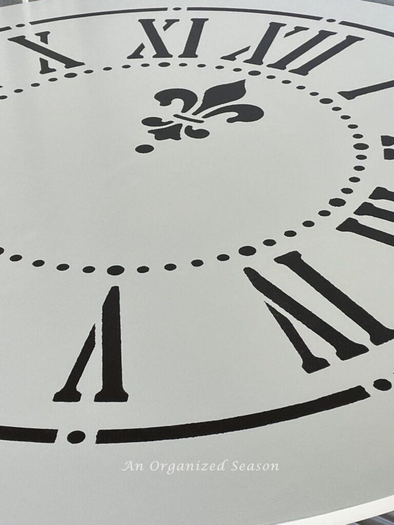 Clock face stencil on a table top. 