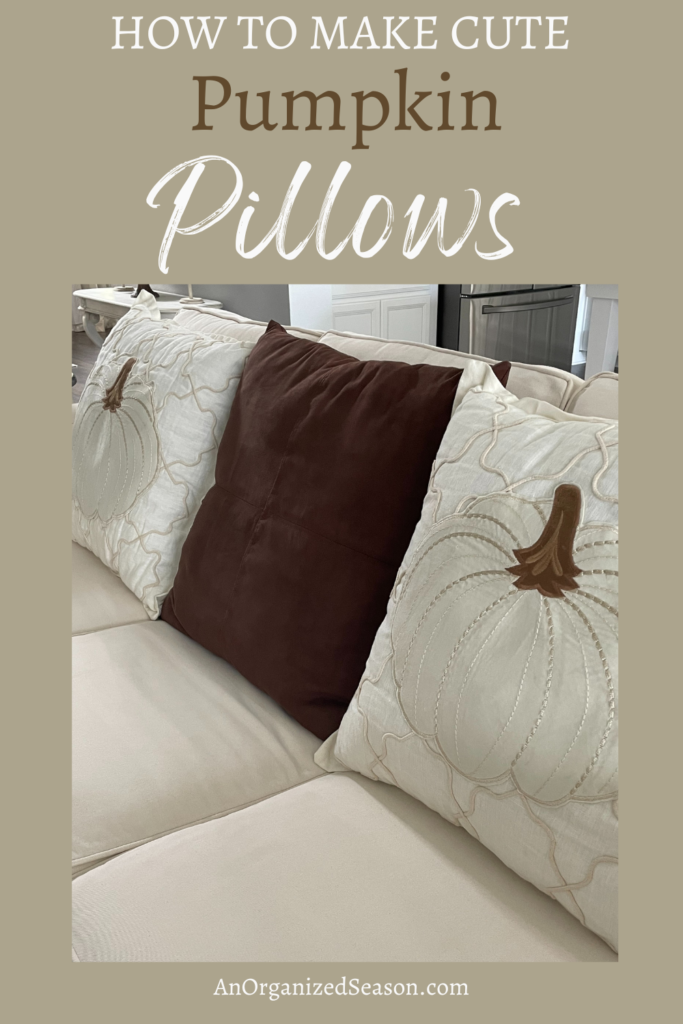 DIY pumpkin pillows beside a brown pillow. 