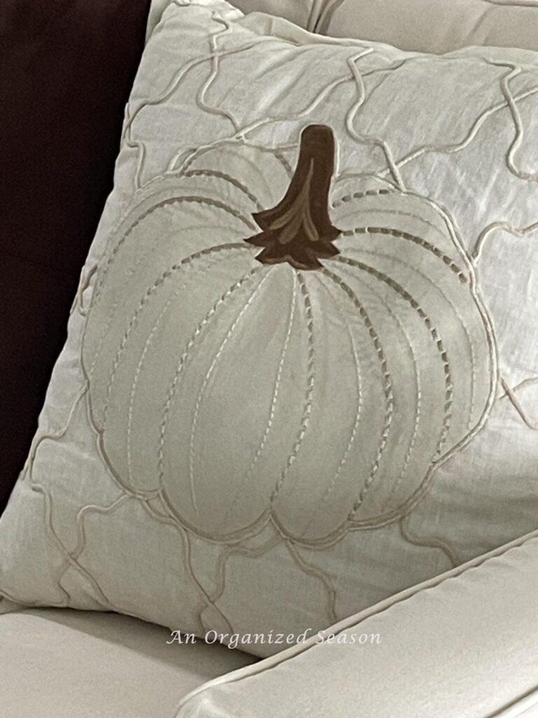 A DIY pumpkin pillow made from a placemat. 
