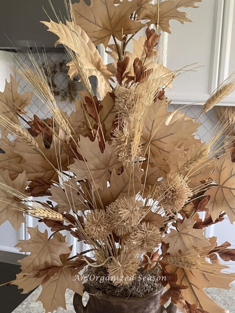 Neutral colored fall floral arrangement. 