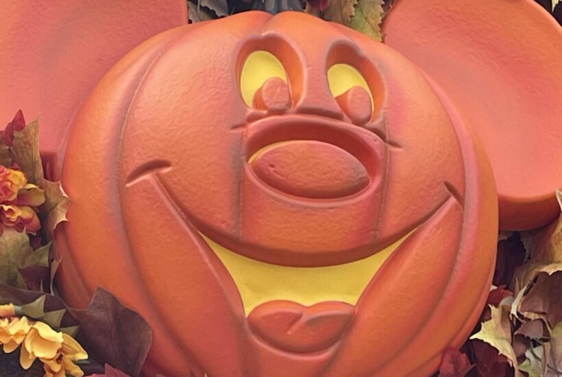 Mickey pumpkin head inside a fall wreath.